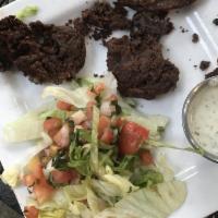 Black Bean Cakes · Seasoned, pan-fried black bean cakes served with lettuce, pico and lime crema sauce.