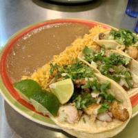 Fish Tacos · 3 tilapia tacos topped with onions, cilantro and your choice of corn or flour tortillas. Ser...