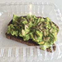 Avocado Toast · Whole avocado on squaw bread, pumpkin seeds, salt, pepper and chipotle sauce.