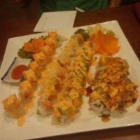 Hayashi Special Roll · California roll topped with smoked salmon avocado, shrimp, green onion, bonito, eel and spec...