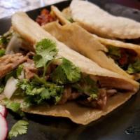 Tacos · Fresh made corn tortillas filled with choice of meat, cilantro, and onions.