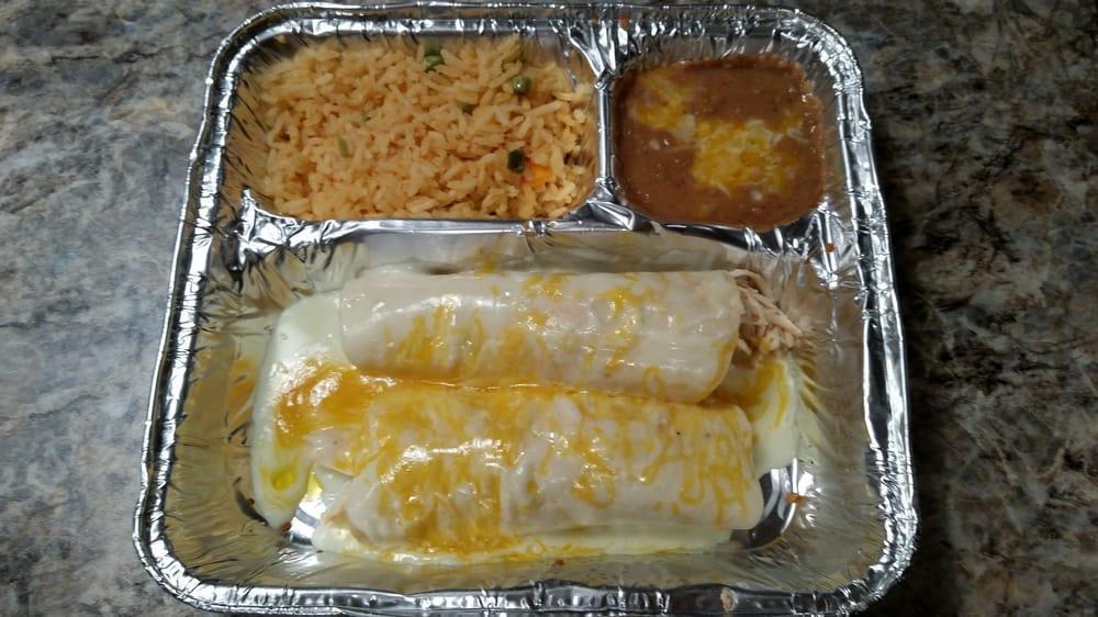 Enchilada Dinner · Your choice of 2 cheese, chicken or beef enchiladas with choice of sauce (chili, sour cream or ranchera) and cheese on top, served with rice and beans.