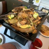 La Parillada for 2 Persons · Beef fajita, chicken fajita, pork chops, shrimp, rice and beans, served with guacamole and p...