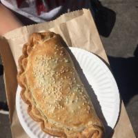 Spinach and Feta Pastie · One of our best sellers. Tender spinach, creamy feta, and organic tomatoes with a hint of sp...