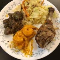 Curry Goat · Trini Style Curry Goat  served with pumpkin rice