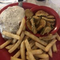 Country Fried Steak · Cubed sirloin steak, hand-breaded and deep fried, smothered in homemade brown gravy with gri...