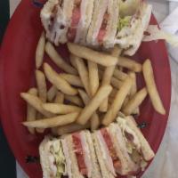 Classic Club Sandwich · Deli sliced turkey, bacon, lettuce, tomato and mayo on white toast.