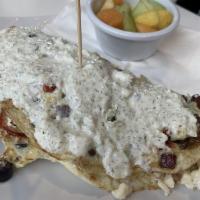 Greek Omelet · Egg whites, roasted tomatoes, Kalamata olives, red onion, feta cheese, topped with a Greek y...