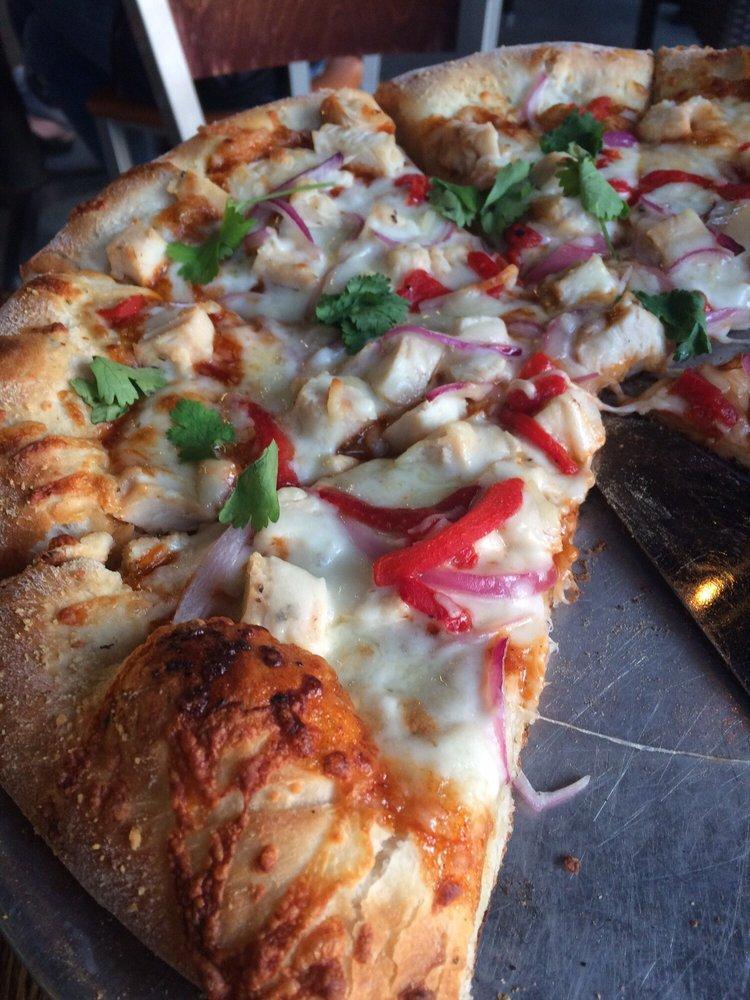 Ruckus BBQ Chicken Pizza · Chopped chicken breast, red onions, Vermont cheddar, fresh cilanto, roasted red peppers and Ruckus sauce base.