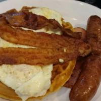 Hungry Man · Choice of challah French toast, pancakes or waffle with 2 eggs, ham, bacon and sausage.