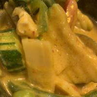 Red Curry · Red chili paste cooked with cream of coconut, snow peas, bamboo shoots, basil leaves, zucchi...