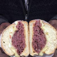 Trigger Happy Sandwich · Hot pastrami, Swiss cheese, remoulade sauce and coleslaw.