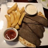 Gyro Platter · Thin slices of lamb and beef gyro, grilled pita points, and french fries. Served side of Gre...