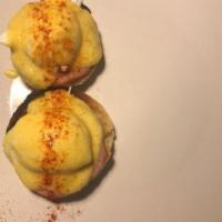 Eggs Benedict · 2 poached eggs with Canadian bacon served over Thomas English muffin and topped with holland...