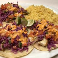 Tacos · Corn tortilla stuffed with your choice of our specialty meat, onions cilantro and lime on th...
