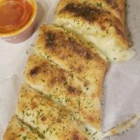 Garlic Cheese Roll · Handcrafted using our fresh baked dough, stuffed with whole milk mozzarella, fresh garlic, t...