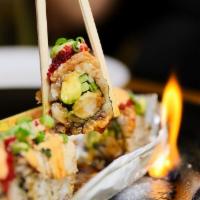 Fire Bruins Maki · Shrimp tempura, avocado, scallion, cucumber, topped with torched yellowtail, eel sauce and t...
