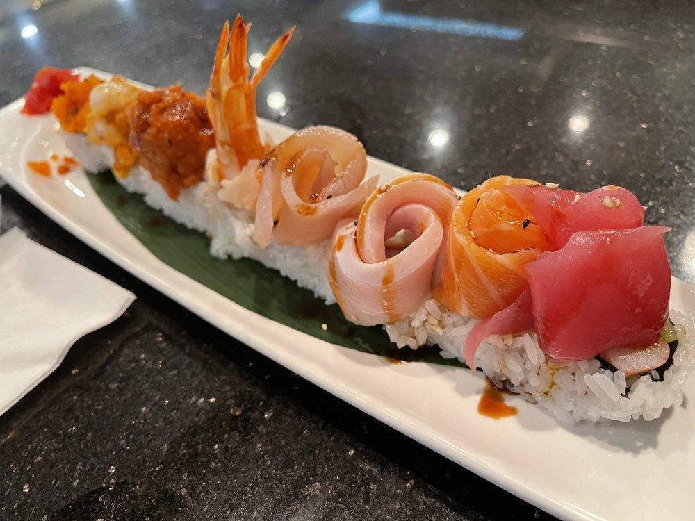 Fashion Show Roll · California roll topped with Ahi Tuna, salmon, yellowtail, albacore, shrimp, smelt egg, spicy tuna and spicy scallop served with yuzu and sweet eel sauce.