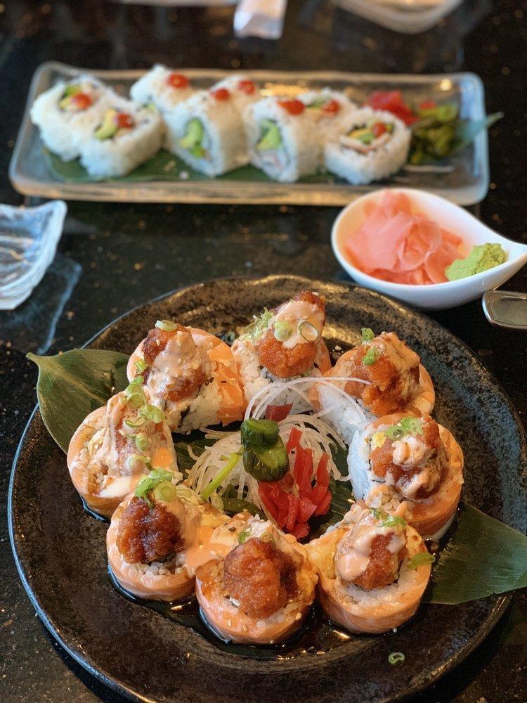 Red Mountain Roll · California roll wrapped with salmon topped with spicy tuna. Served with house special sauce. Spicy.
