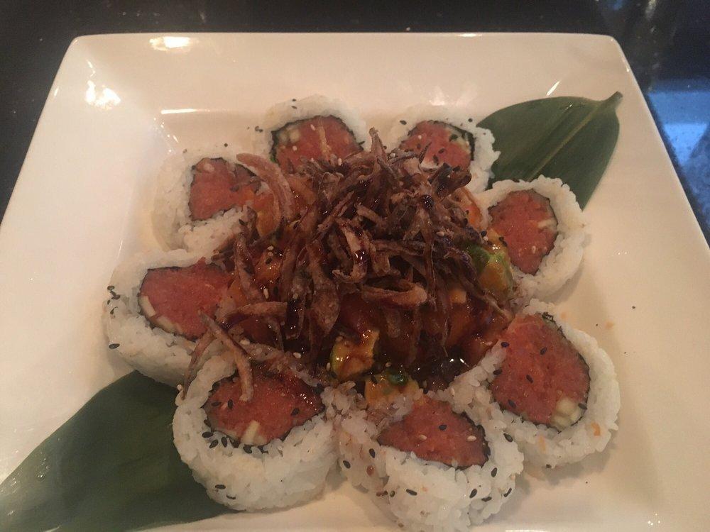 Salsa Dance Roll · Spicy crab topped with salmon, avocado, tomato and smelt egg mixed with Japanese mustard and spicy Sriracha sauce. Served with crispy onions and sweet eel sauce. Spicy.