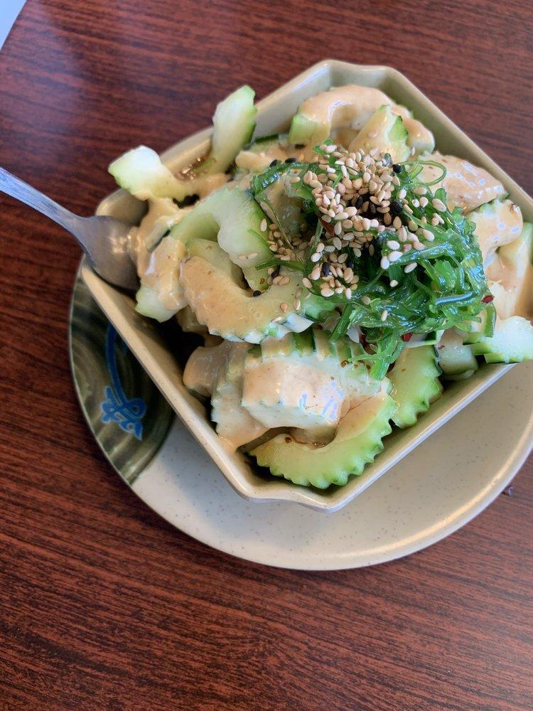 Cucumber Salad · Sliced cucumber on top of shredded daikon with a little bit of seaweed salad on top, sweet vinaigrette, and creamy sesame sauce.
