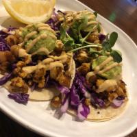 Cauliflower Chickpea Tacos · Baked cauliflower, chickpeas, cabbage, mashed avocado and southwest sauce.
GF with corn tort...