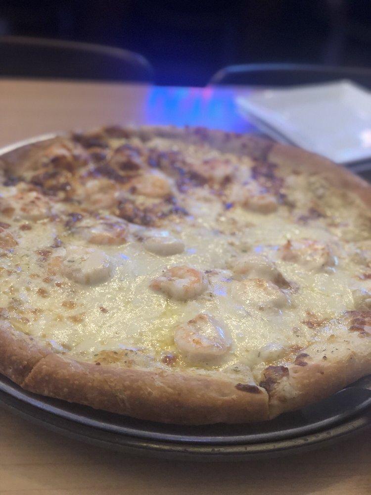 Seafood Pizza · Brix homemade scampi sauce brushed on fresh dough topped with lump crab meat, shrimp and a blend of mozzarella and provolone cheese.