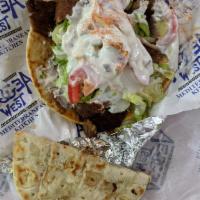 Gyro Sandwich · Served with lettuce, tomato, onions and tzatziki sauce.