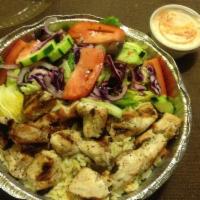 Chicken Kebab Platter · Served with choice of side, pita, salad and tzatziki.