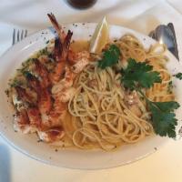 Shrimp Scampi · Shrimps sauteed in white wine, garlic, and lemon sauce over linguine.
