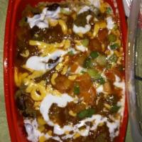 Turkey Chili · Lean ground turkey, red beans, reduced fat cheddar cheese, salsa and fat free sour cream ove...
