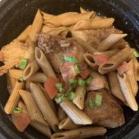 Cajun Chicken and Penne · Chicken breast in a red wine brown sauce garnished with tomatoes and scallions. Two servings.