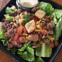 Lean and Mean Cheeseburger Salad · Premium beef burger atop romaine lettuce with reduced fat cheddar cheese and fat free hickor...