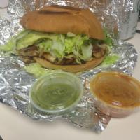 Torta · Torta with a choice of meat. Includes lettuce, tomato, cheese, beans, and avocado