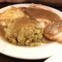 Slow Roasted Turkey Dinner · Slow roasted fresh turkey breast, topped with turkey gravy with Parmesan mashed potatoes or ...