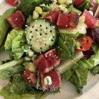 Seared Ahi Tuna Salad · Mixed greens, wasabi, peas, edamame, cucumber, cherry tomatoes and ginger vinaigrette.