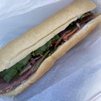 Corned Beef Banh Mi · Chau's specialty with a twist on the traditional banh mi. Corned beef lightly grilled to per...