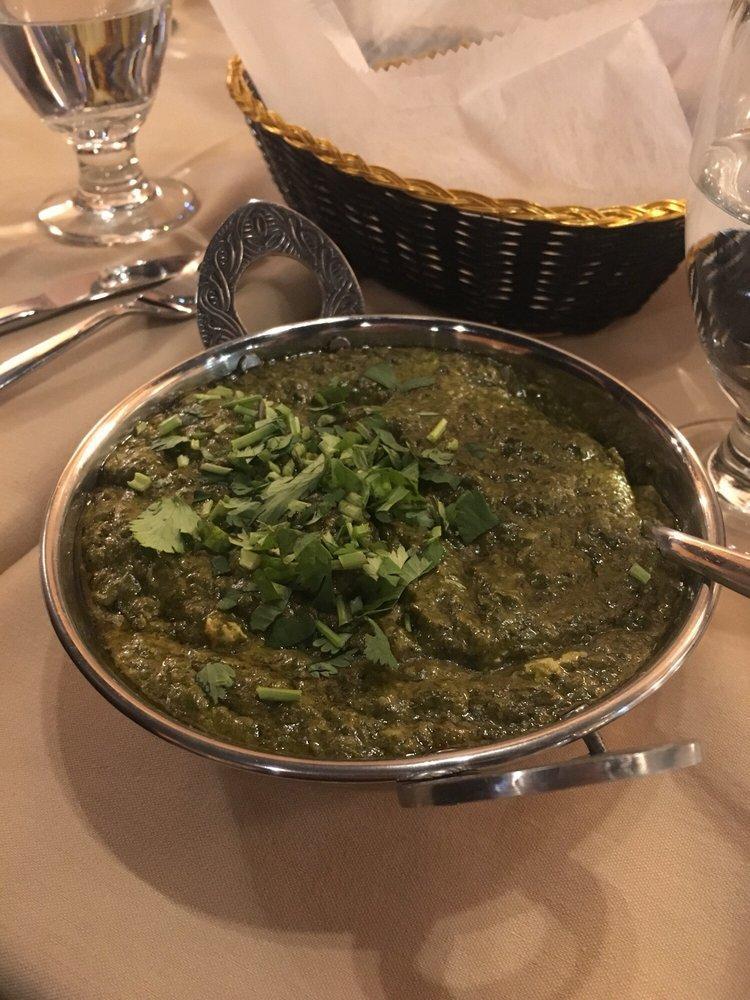 Palak Paneer · Palak paneer is soft paneer cubes cooked in smooth creamy spinach. Served with basmati rice.
