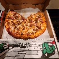 Meat Lovers Pizza · Pizza sauce, mozzarella cheese, pepperoni, beef, sausage, bacon, and ham.