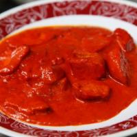 Chicken Tikka Masala · Chicken cubes cooked with special tandoori mild spicy sauce light creamy sauce.Served with b...