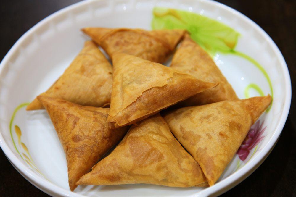 Chicken Samosa · Crispy pastry filled with minced chicken.
