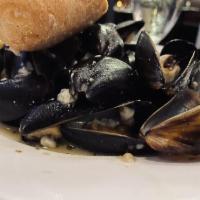 Mussels Tuscany · Gorgonzola cream, pancetta, and white wine sauce.