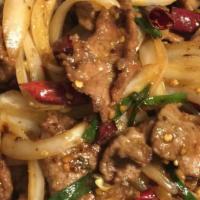 Mongolian Beef · Sliced tender beef seared with onions, scallions in special Mongolian sauce. Spicy.