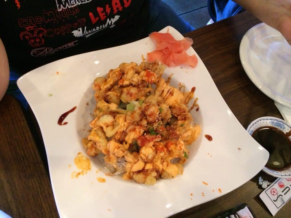 Popcorn Roll · California roll topped with bits of deep-fried lobster tail. Spicy mayo and eel sauce on top.