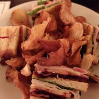 Triple Decker Club Sandwich · Smoked turkey, Virginia peppered ham, Muenster cheese, bacon, lettuce and tomato on white to...