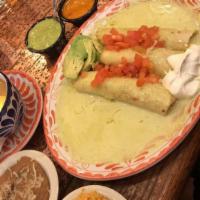 Enchiladas · Cheese, chicken, beef choice of filling rolled in corn tortillas topped with choice of house...