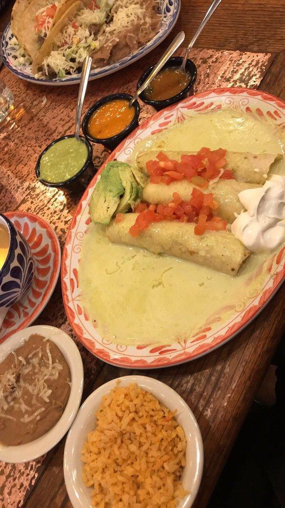 Enchiladas · Cheese, chicken, beef choice of filling rolled in corn tortillas topped with choice of house-made sauce.