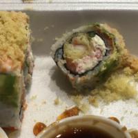 Super Dragon Roll · Shrimp tempura, asparagus, krab salad, c/c, masago & raw salmon. Topped with avocado steam s...