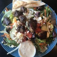 Greek Salad · Chopped fresh spinach, olives, feta cheese and Greek dressing.