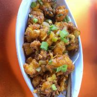 Gobi Manchurian · Cauliflower marinated with Indian spices, Sauteed with Manchurian Sauce / Deep fried.